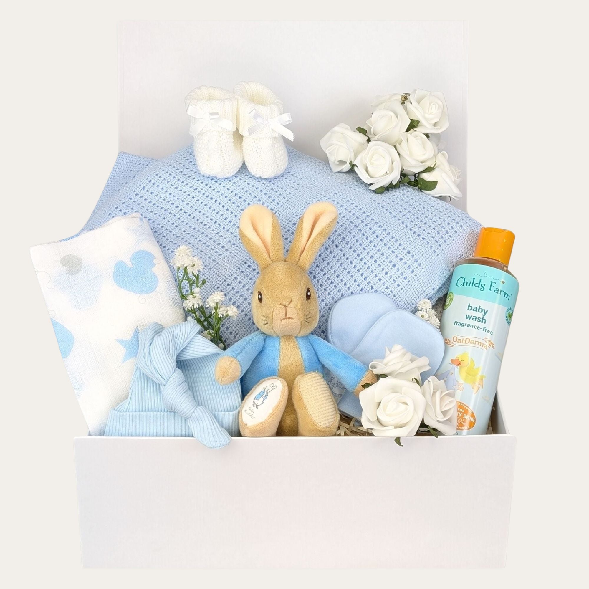 New baby boy gifts hamper in a box packed with  peter rabbit soft toy, blue baby blanket, muslin square Bumbles and Boo.