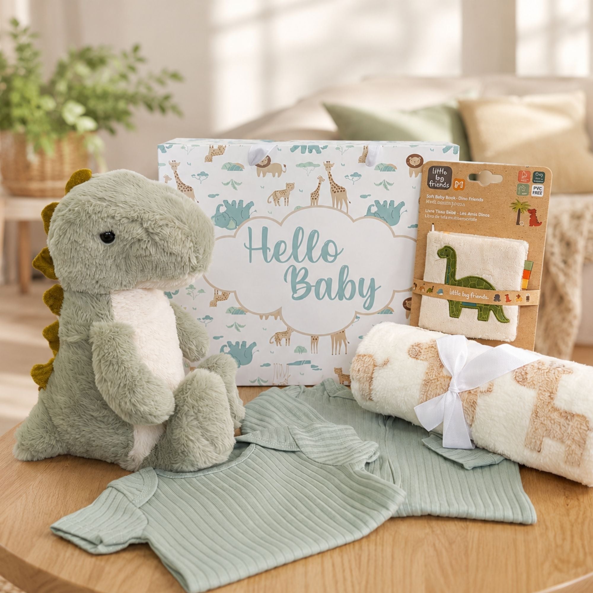 New baby boy gifts bag with Tommy the dinosaur and sage green clothing