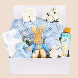 New baby boy gifts hamper in a box packed with  peter rabbit soft toy, blue baby blanket, muslin square Bumbles and Boo.