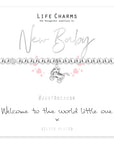 silver plated bracelet to celebrate a new baby with the wording' welcome to the world little one'