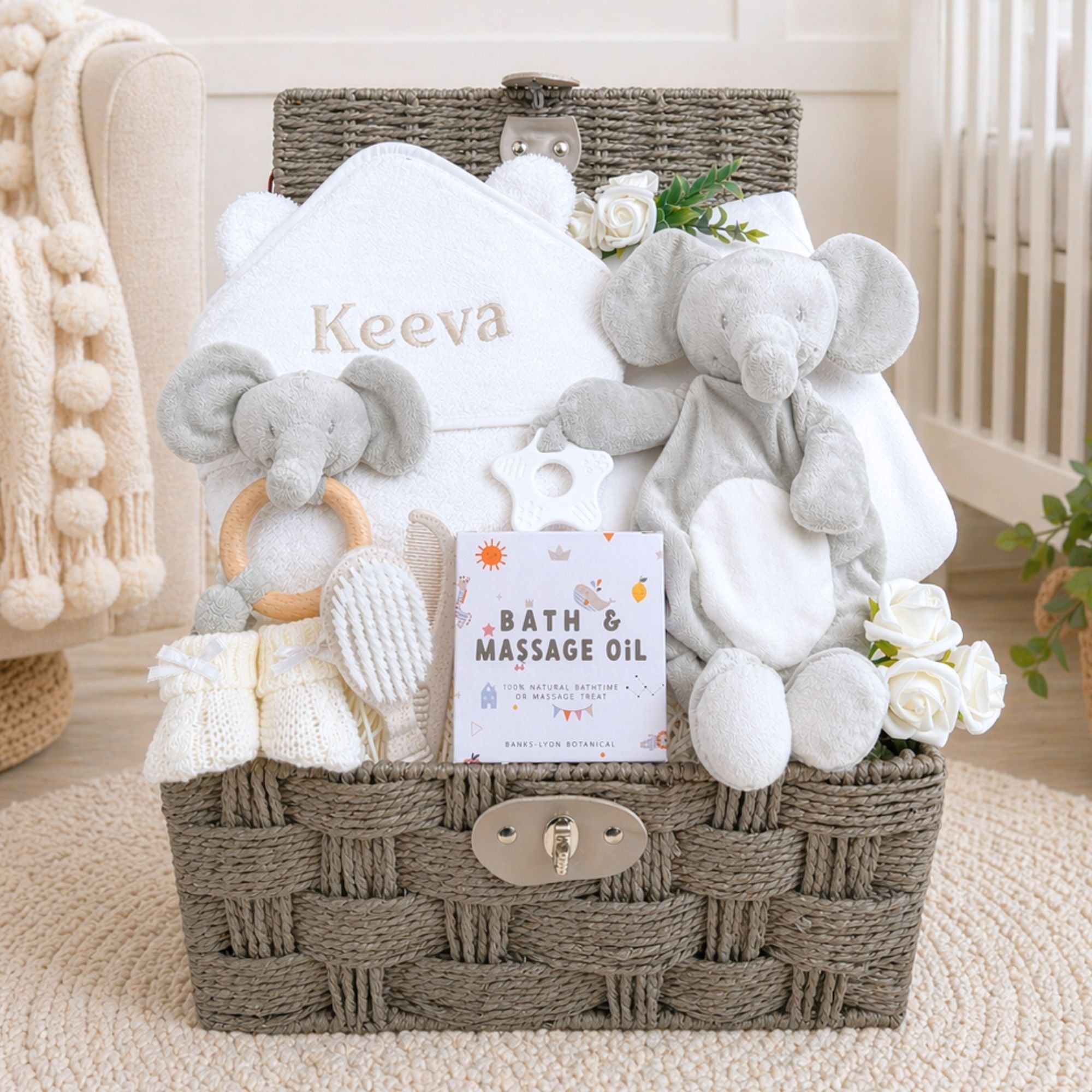 Baby gift basket with elephant comforter soft toy and matching rattle plus bath towel. 