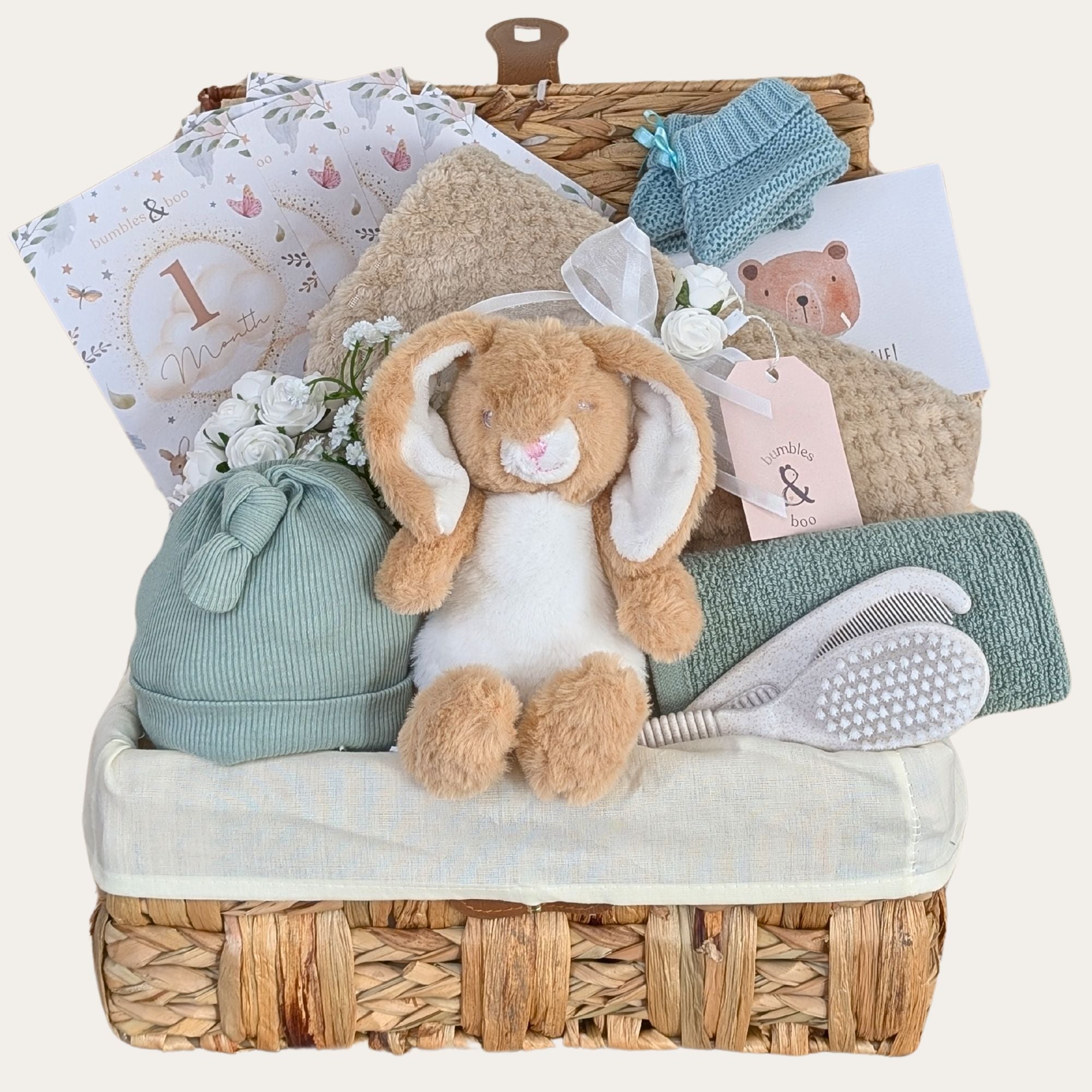 New baby gifts hamper basket with sage green and neutral newborn presents. Bumbles and Boo.