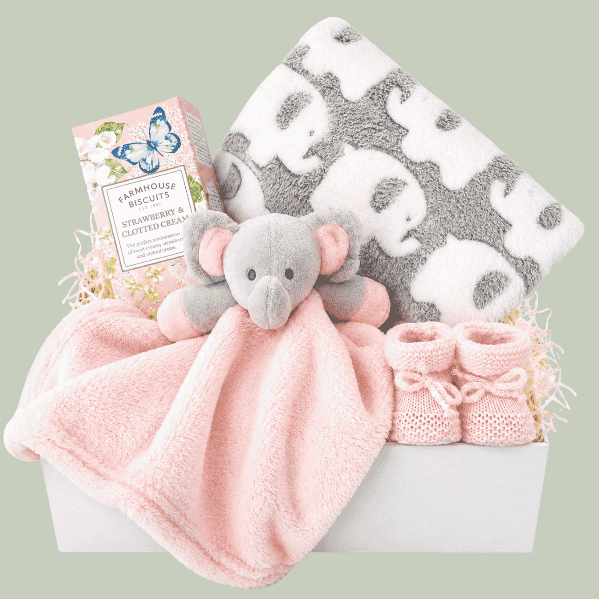 gifts for a baby girl in a white magnetic box with elephant comforter and elephant blanket