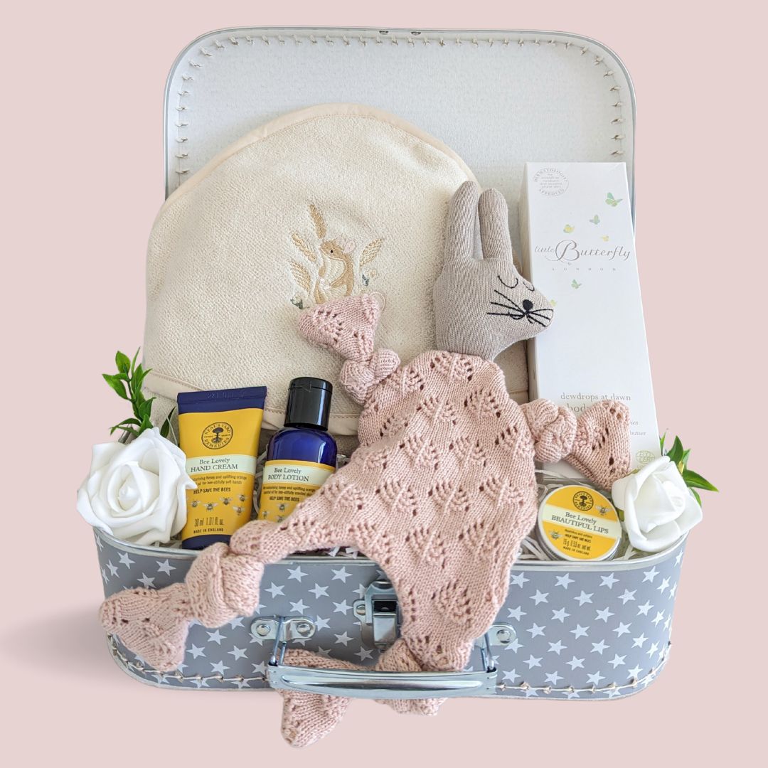 baby girl hamper with organic gifts for both baby and mummy. Presented in a keepsake luggage trunk.