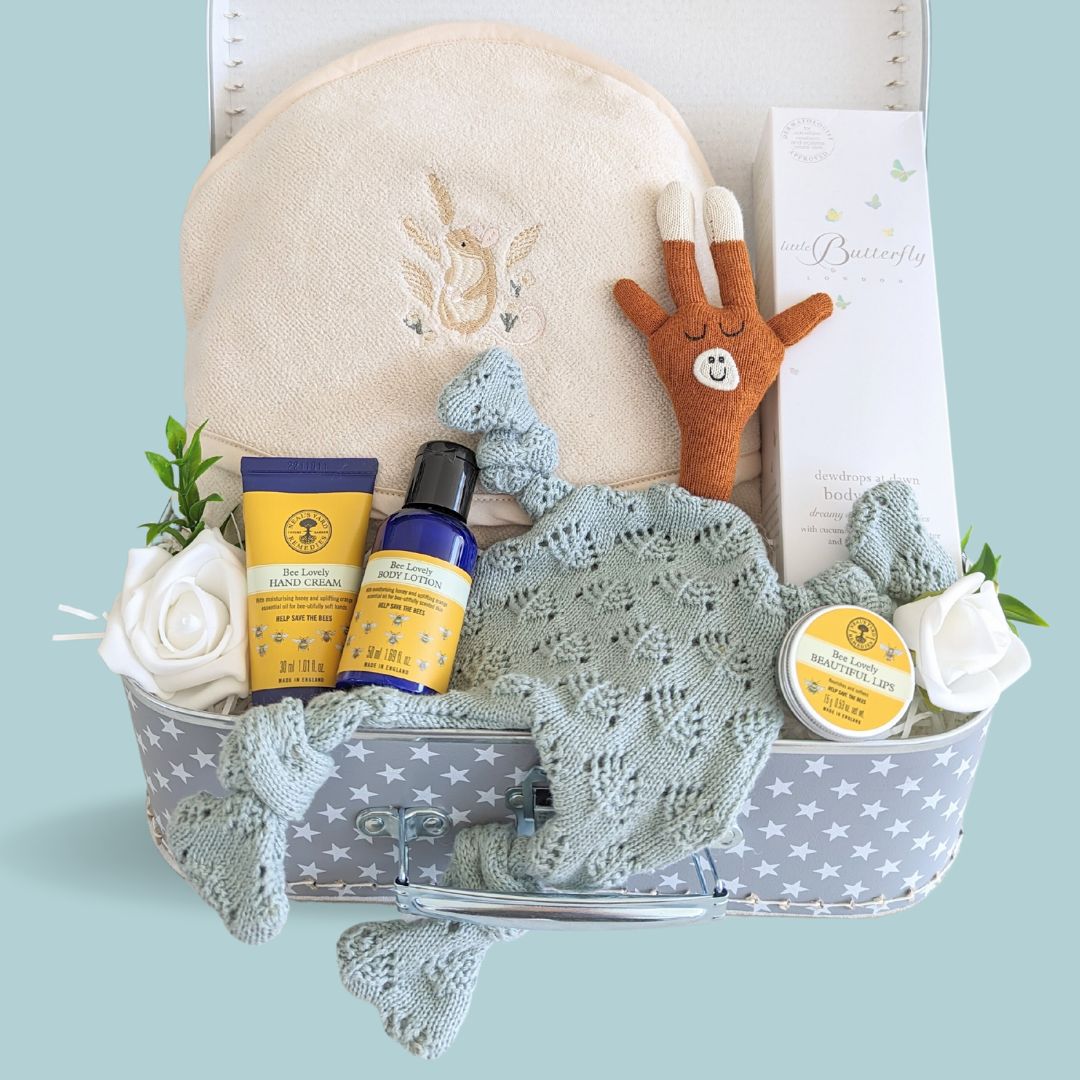 Luxury new baby boy hamper trunk with gifts for both baby and mummy. Organic baby lotion, organic cotton towel, soft comforter toy for baby and organic neal&#39;s yard for a new mummy.