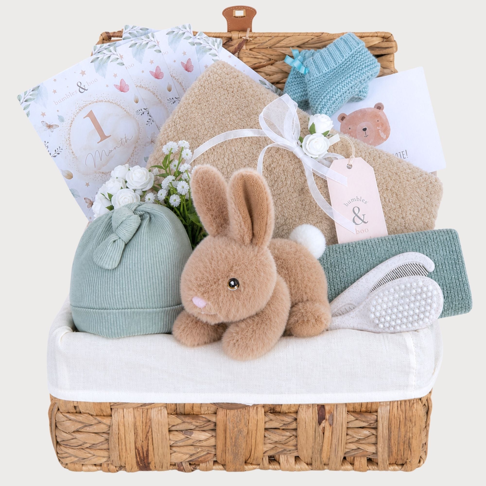 New baby gifts hamper basket with sage green and neutral newborn presents. Bumbles and Boo.