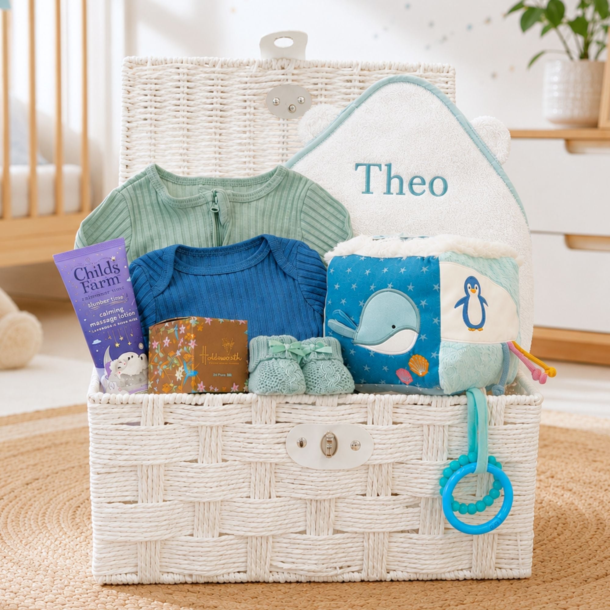 New baby gifts basket with an ocean theme to include clothing set and ocean activity cube