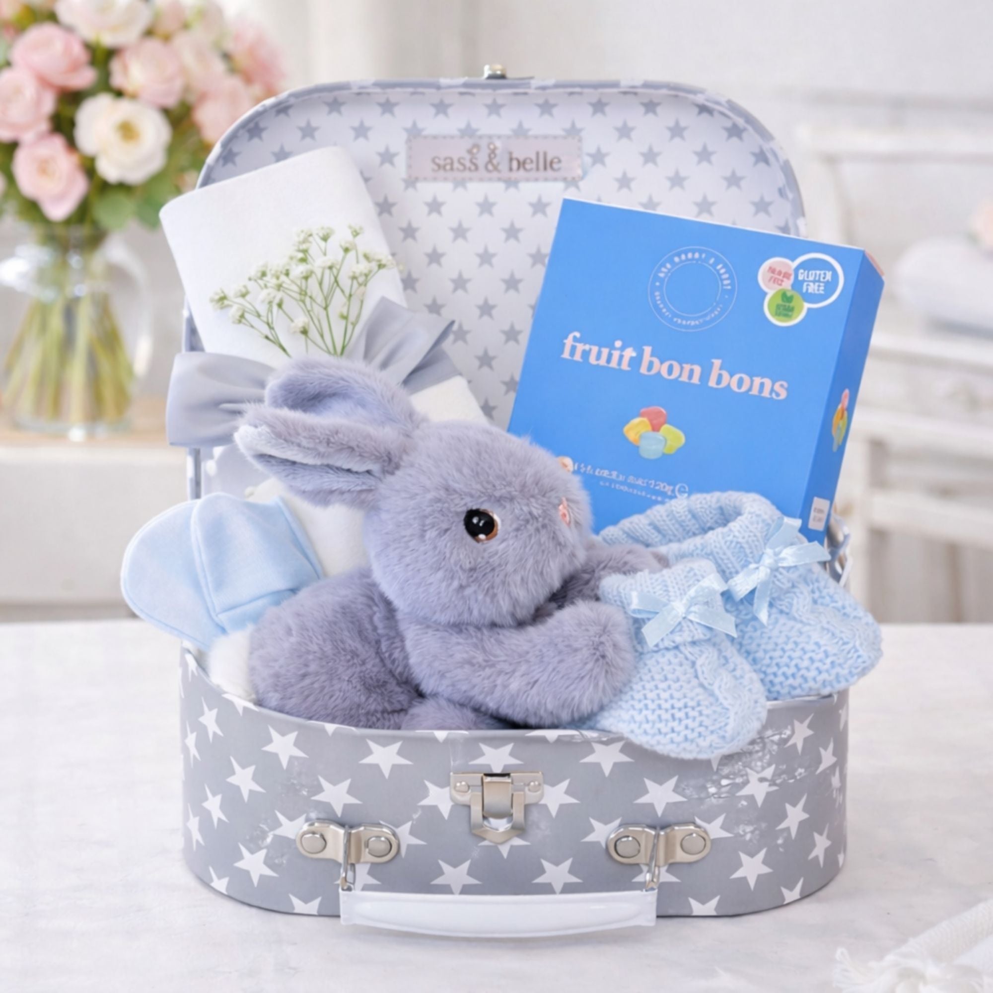 New mother gifts in a hamper with fruit sweets and blue and grey theme