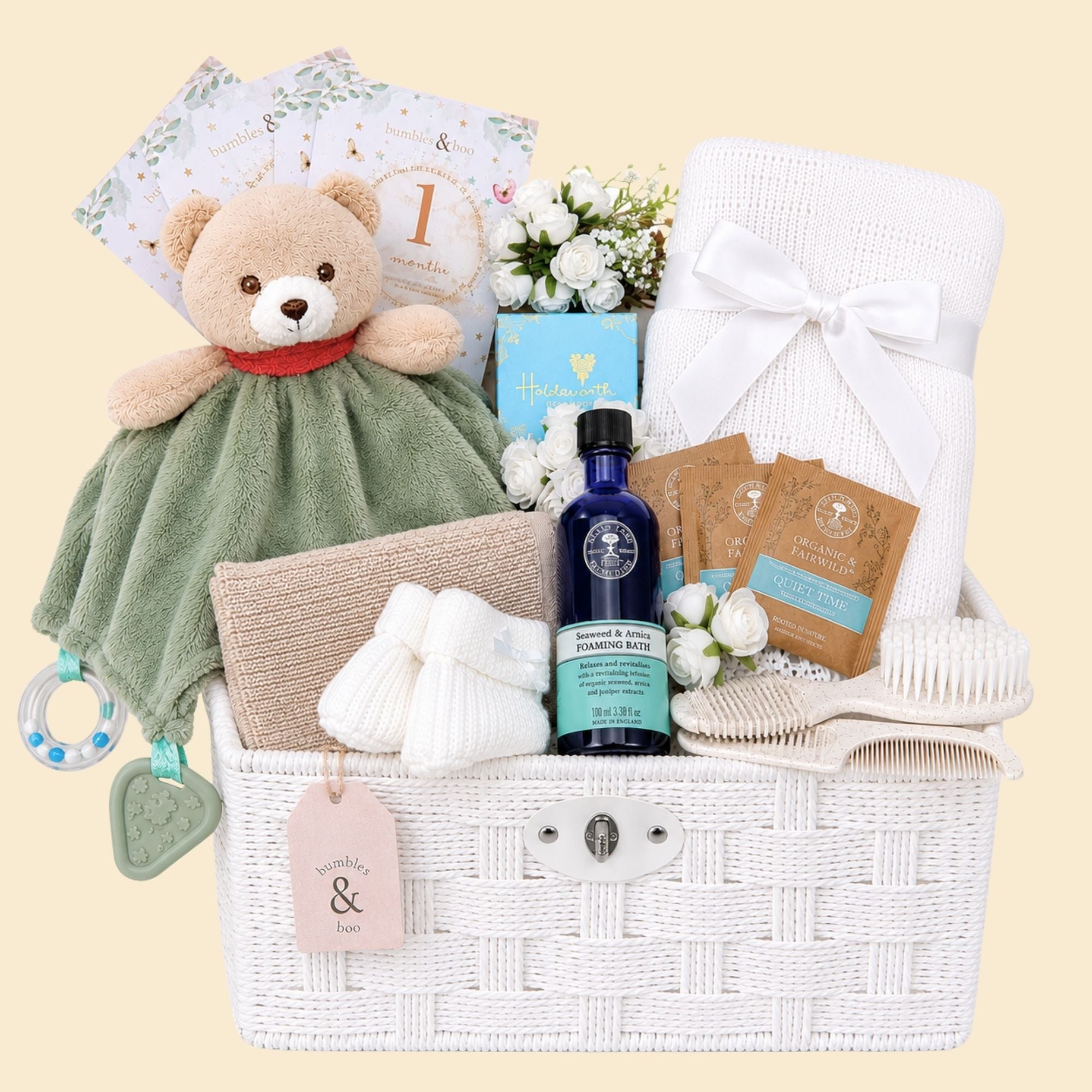 New mother gifts in a hamper basket with neals yard foaming bath and teddy for baby