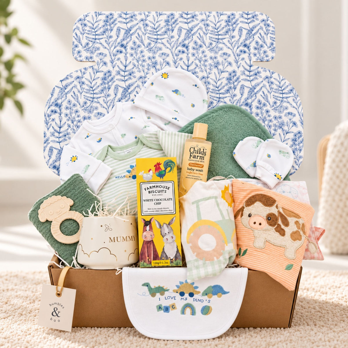 Beautiful new mum gift box with biscuits, mummy mug and dinosaur clothing set.