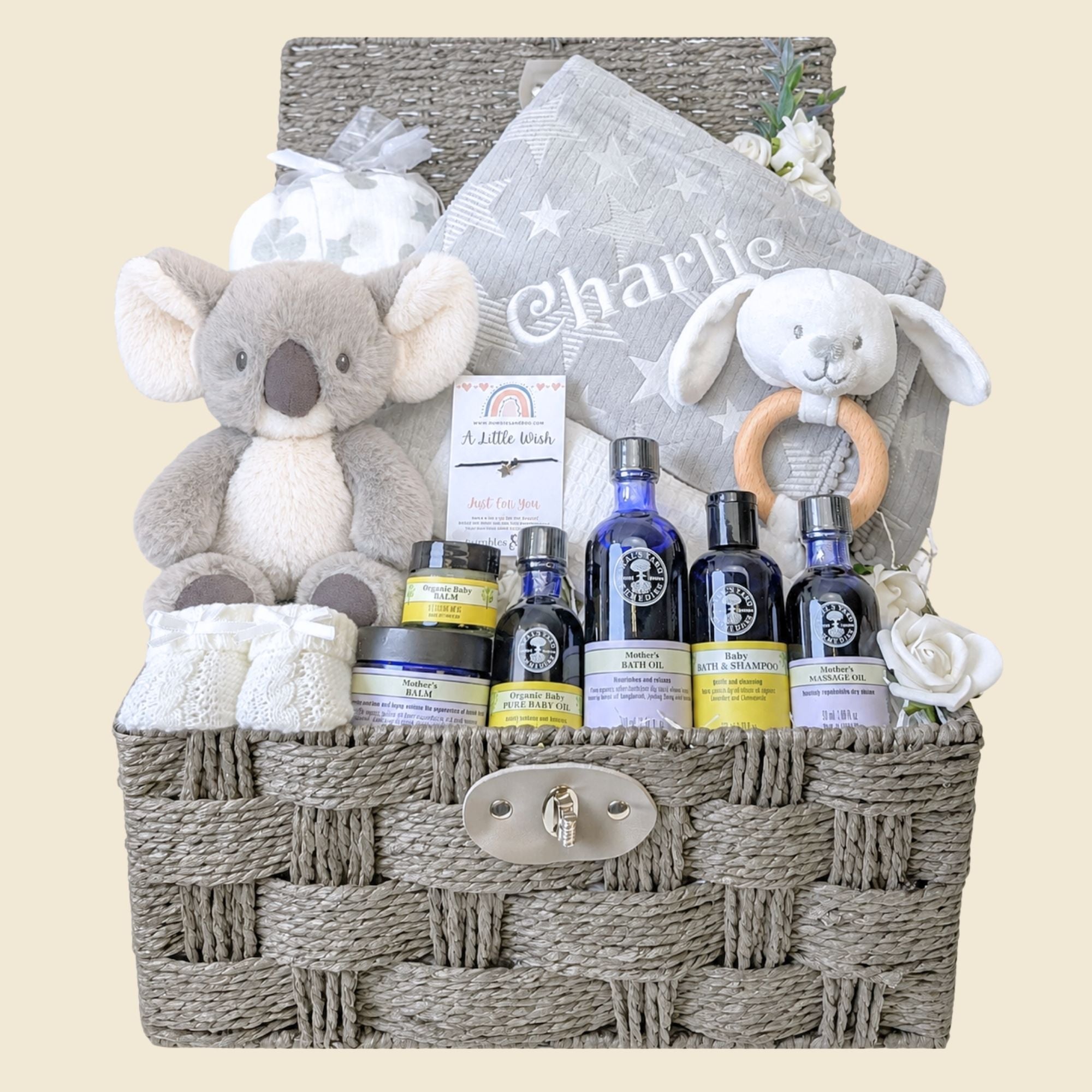 New mum gifts hamper basket with a grey personalised baby blanket and organic skincare. Bumbles and Boo.