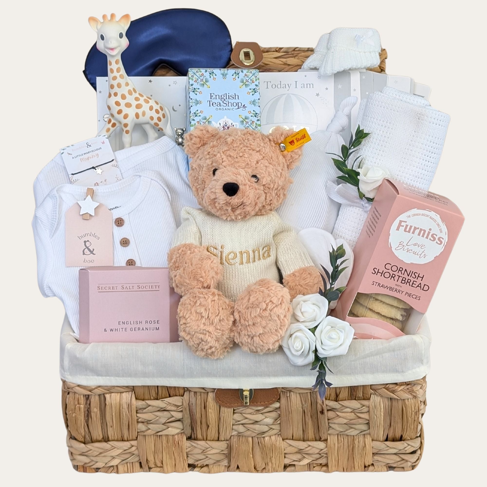 Luxury new mum hamper basket with gifts including biscuits, teddy and pink & white presents. Bumbles and Boo.