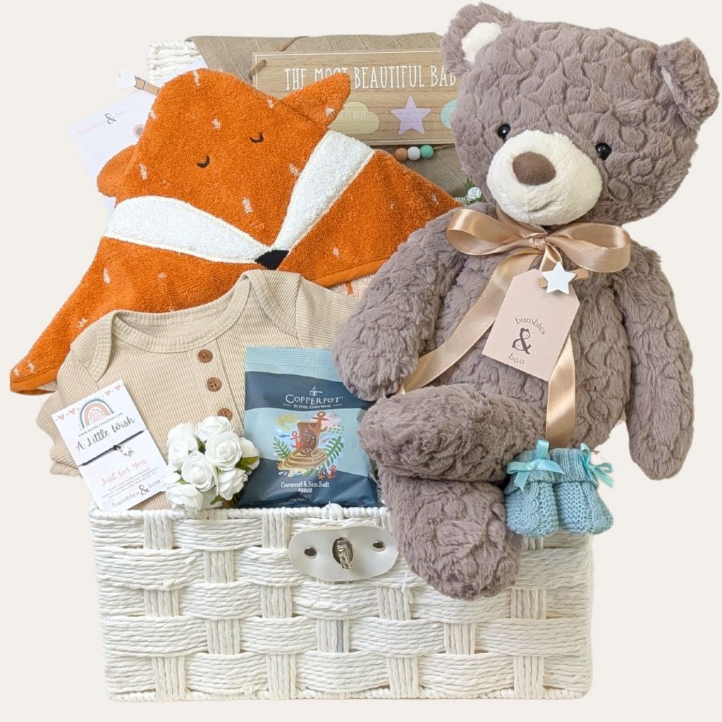New mum hamper basket filled with a variety of eco baby products including fox towel and large plush teddy bear. Bumbles & Boo.