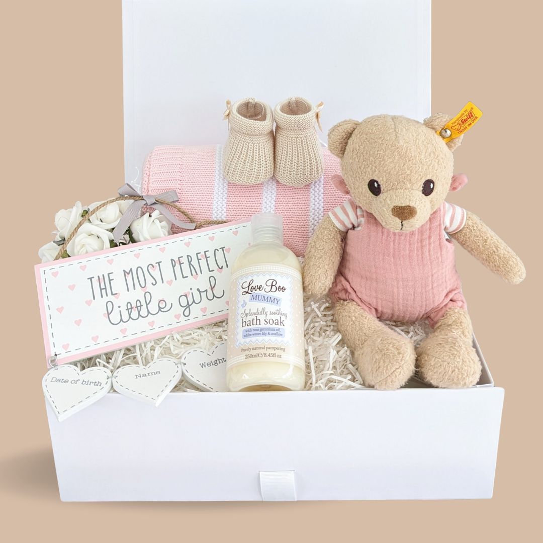 new mum gift box with Steiff teddy bear, pink baby blanket, baby booties and decorative nursery plaque with keepsake details. Presented in magnetic hamper box.