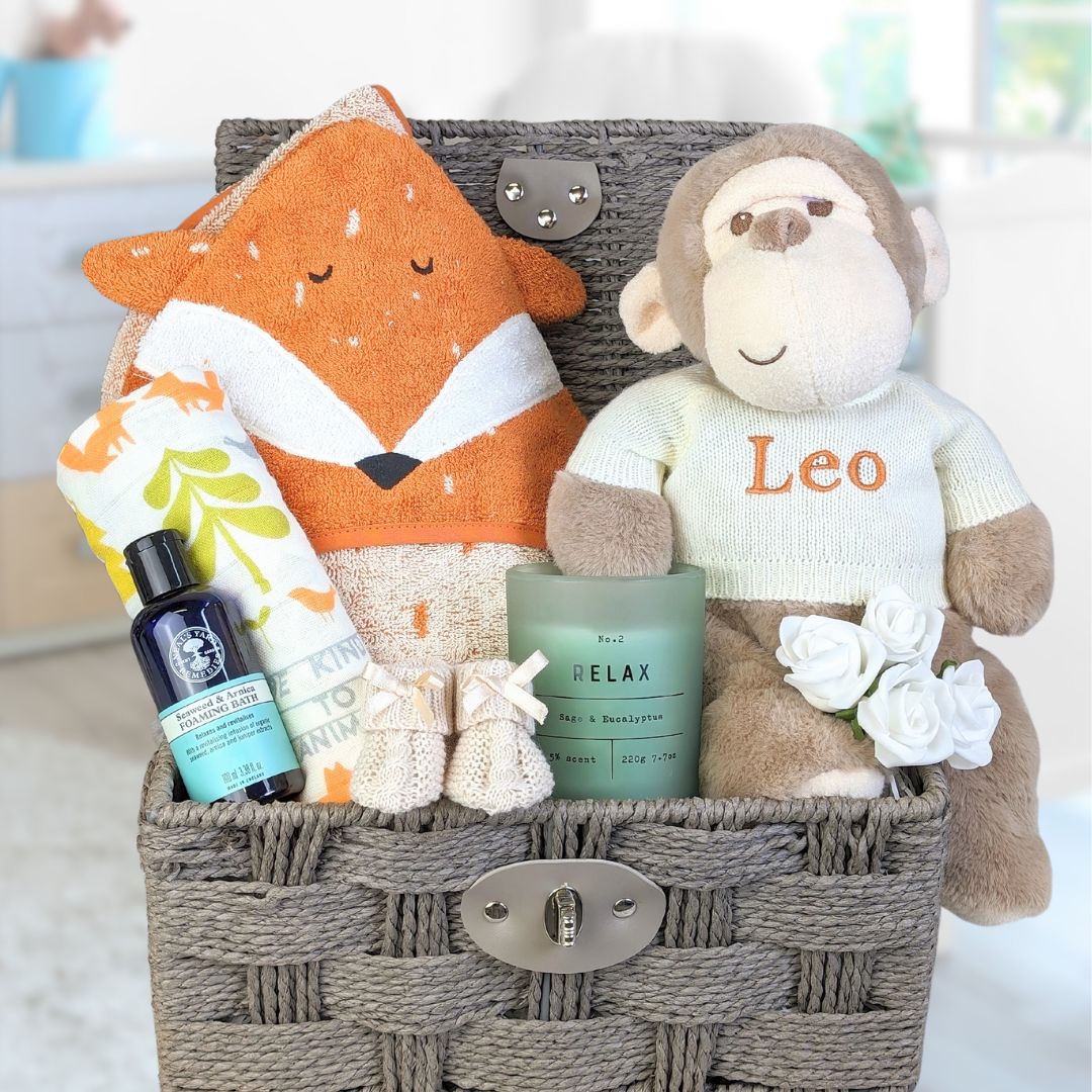 new mum and baby hamper with fox and monkey theme and treats for mum too.