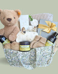 New mum hamper with gifts for baby as well as pamper skincare for a new mum.
