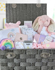 Large baby girl hamper gifts basket with bunny and clothing.