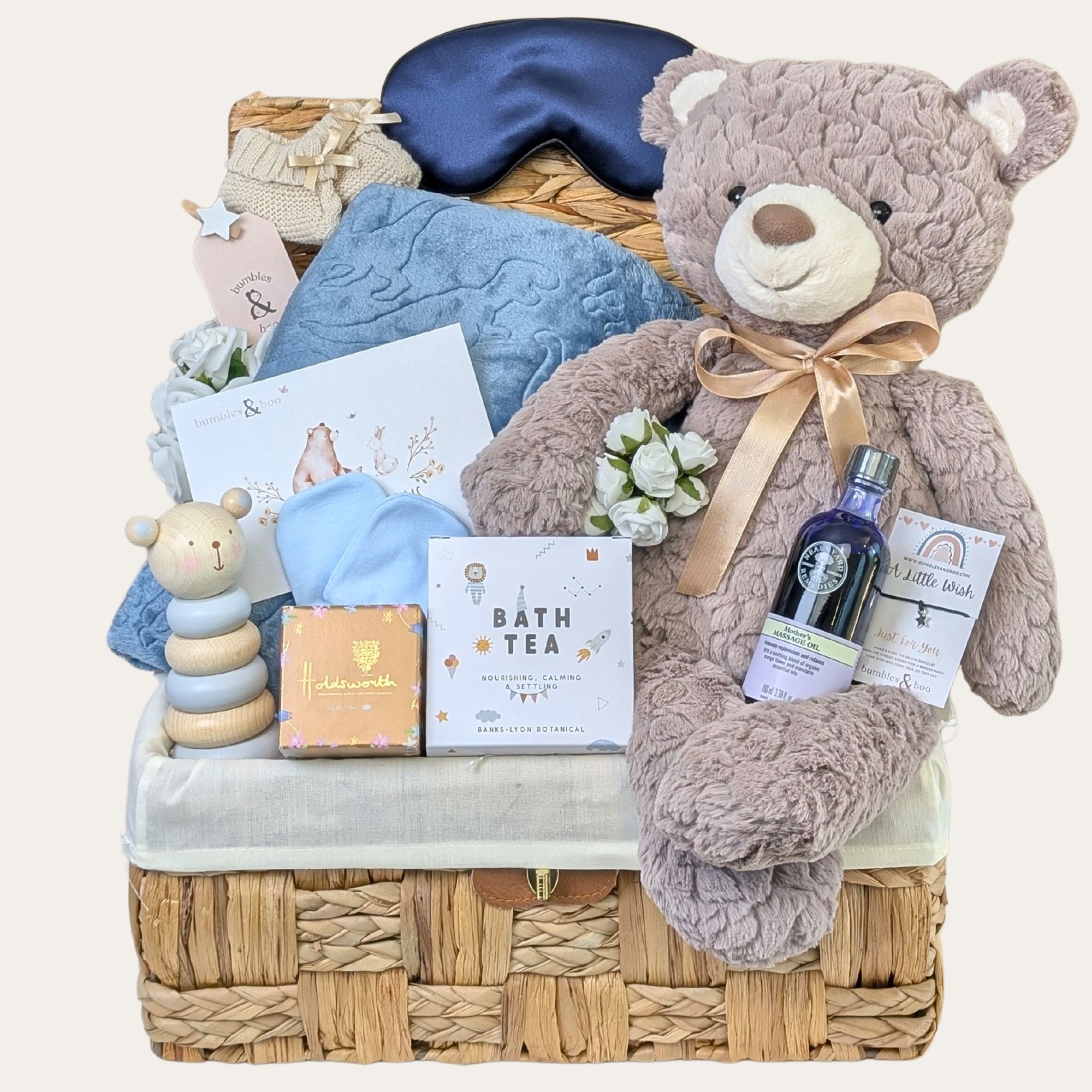 New mum hamper basket brimming with luxury gifts including Neals Yard skin care, large teddy and chocolates. 