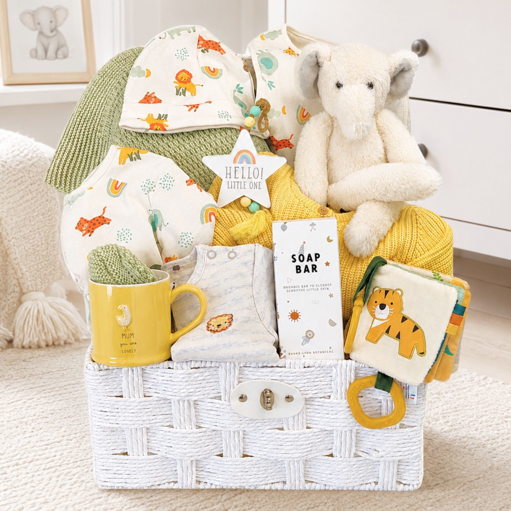 A new mummy gifts hamper with a yellow and green theme plus elephant and activity book.