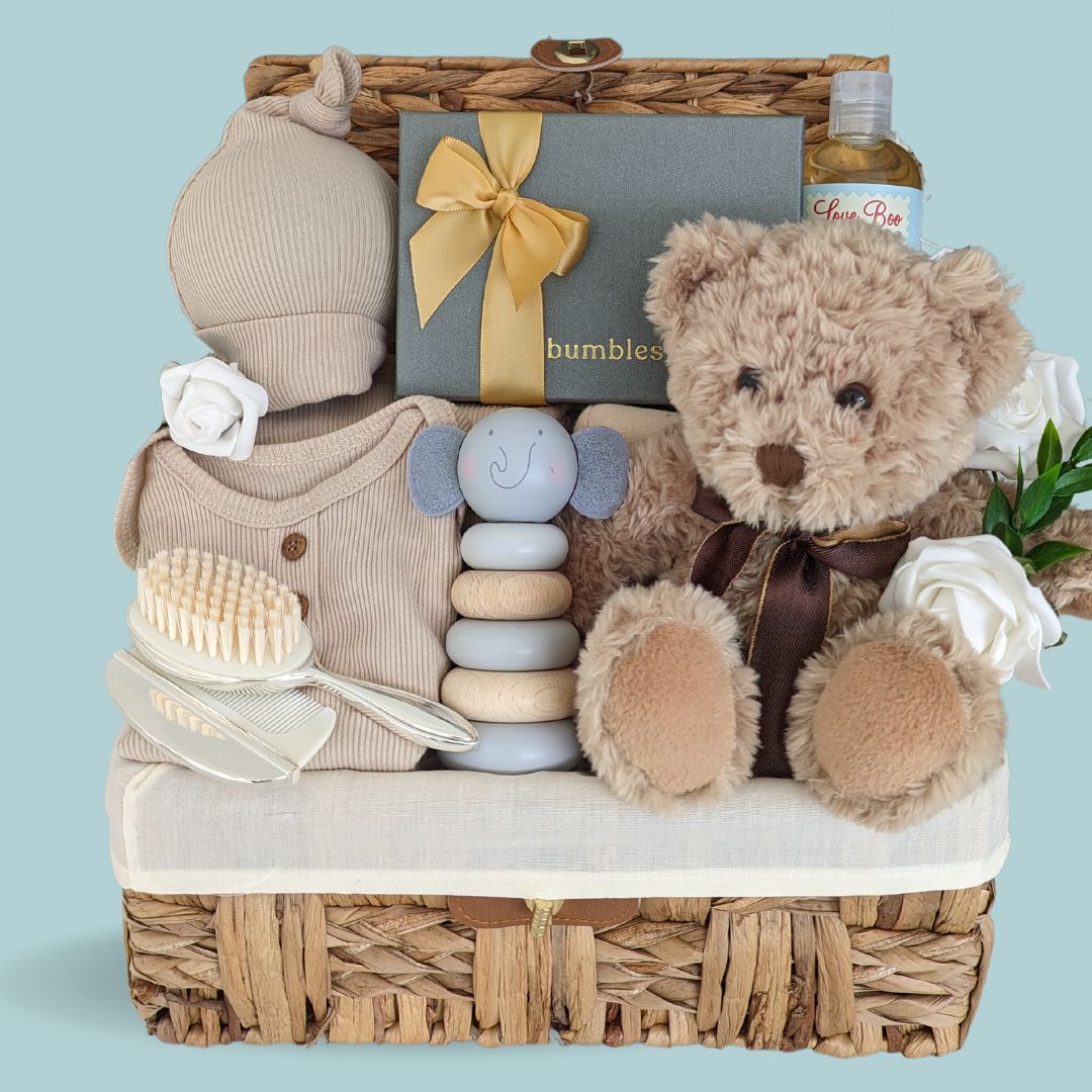 new mum hamper, gifts include silver keepsakes for baby and chocolates for mum.
