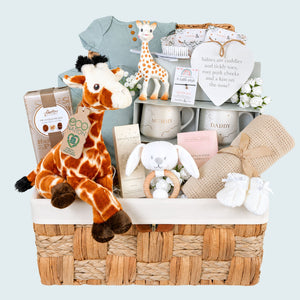 New mum hamper with giraffe theme. Gifts include baby blanket, mum and dad mugs, baby clothing and chocolates. Bumbles and Boo.