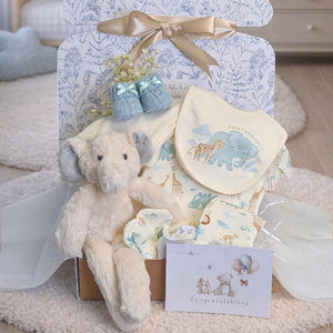 Newborn baby gifts beautifully presented inside a postal gift box.