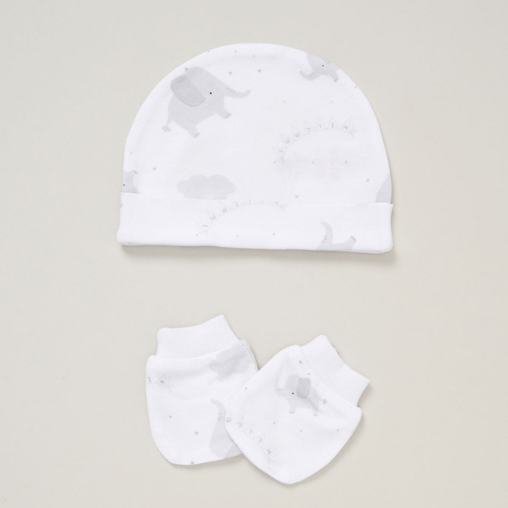 Matching white hat and scratch mittens with grey elephant design