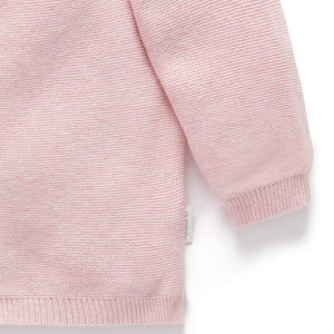 Knitted pink baby cardigan with buttons
