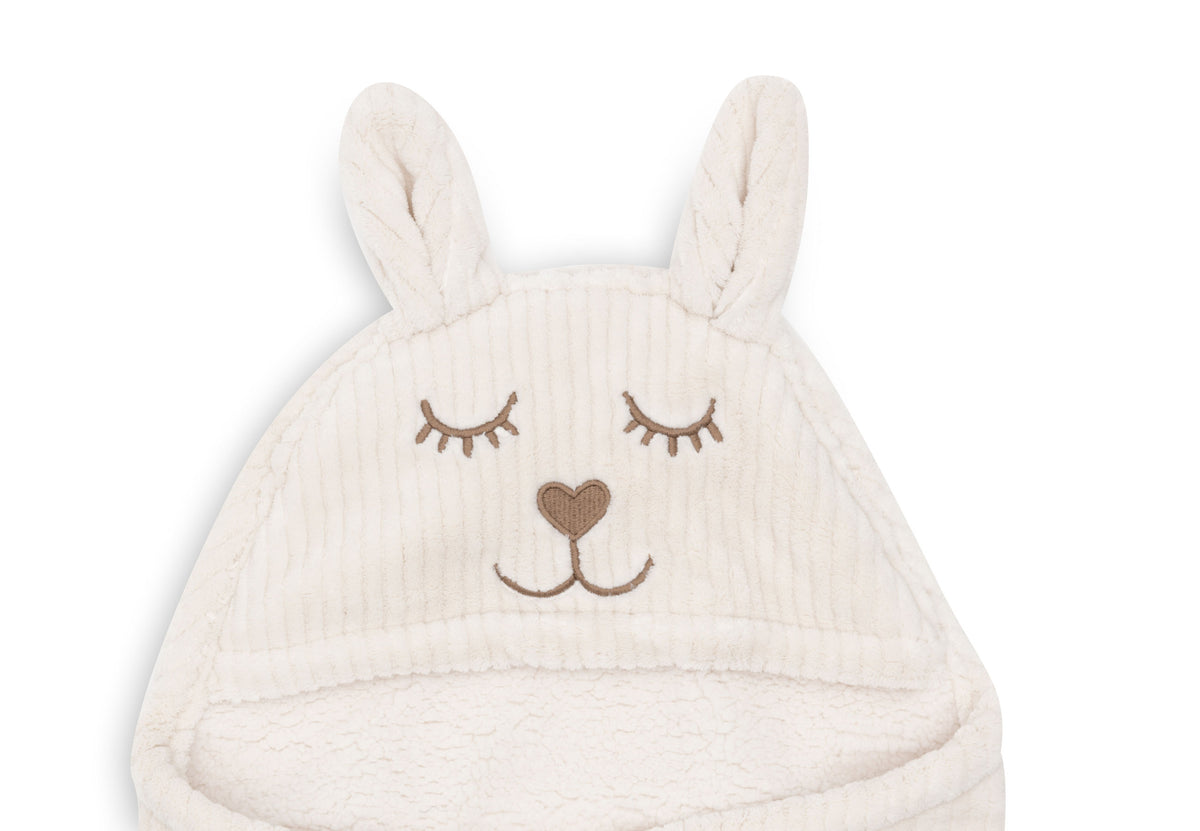 Oatmeal baby wrap blanket with bunny head detail and teddy fleece lining