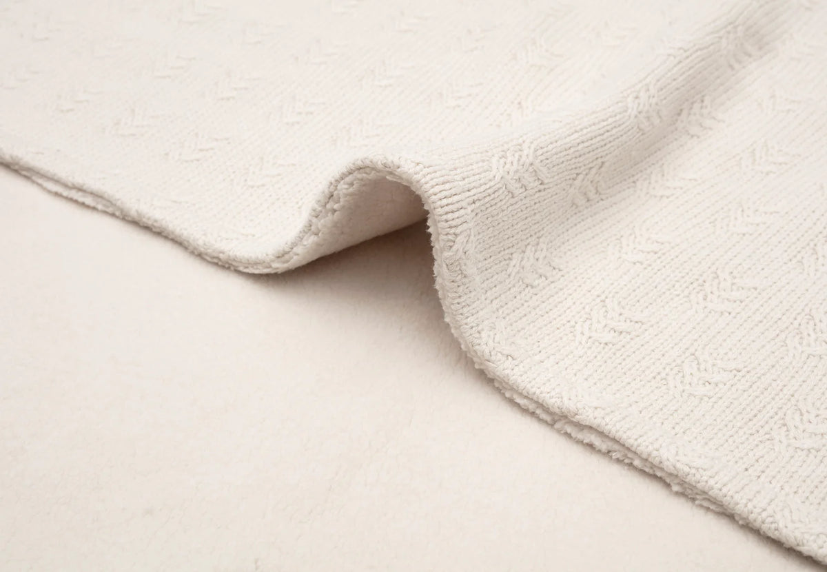 Oatmeal grain knit baby cot blanket measuring 150 x 100 cm