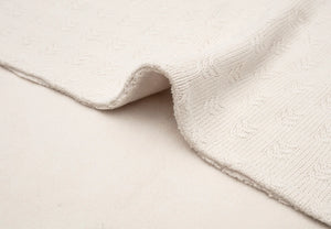 Oatmeal grain knit baby cot blanket measuring 150 x 100 cm