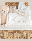 baby hamper basket with organic towel, organic baby bibs and teddy.