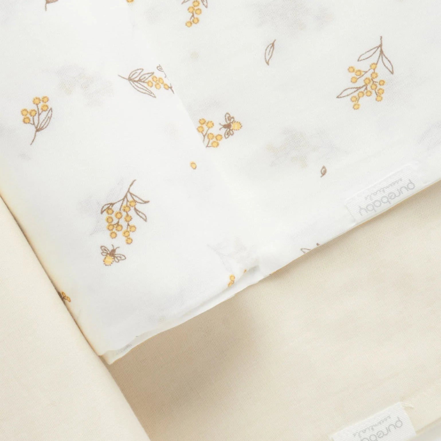 Organic baby muslin wraps in neutral and bee print