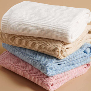 Close up of organic cotton baby blanket showing soft textured knit fabric