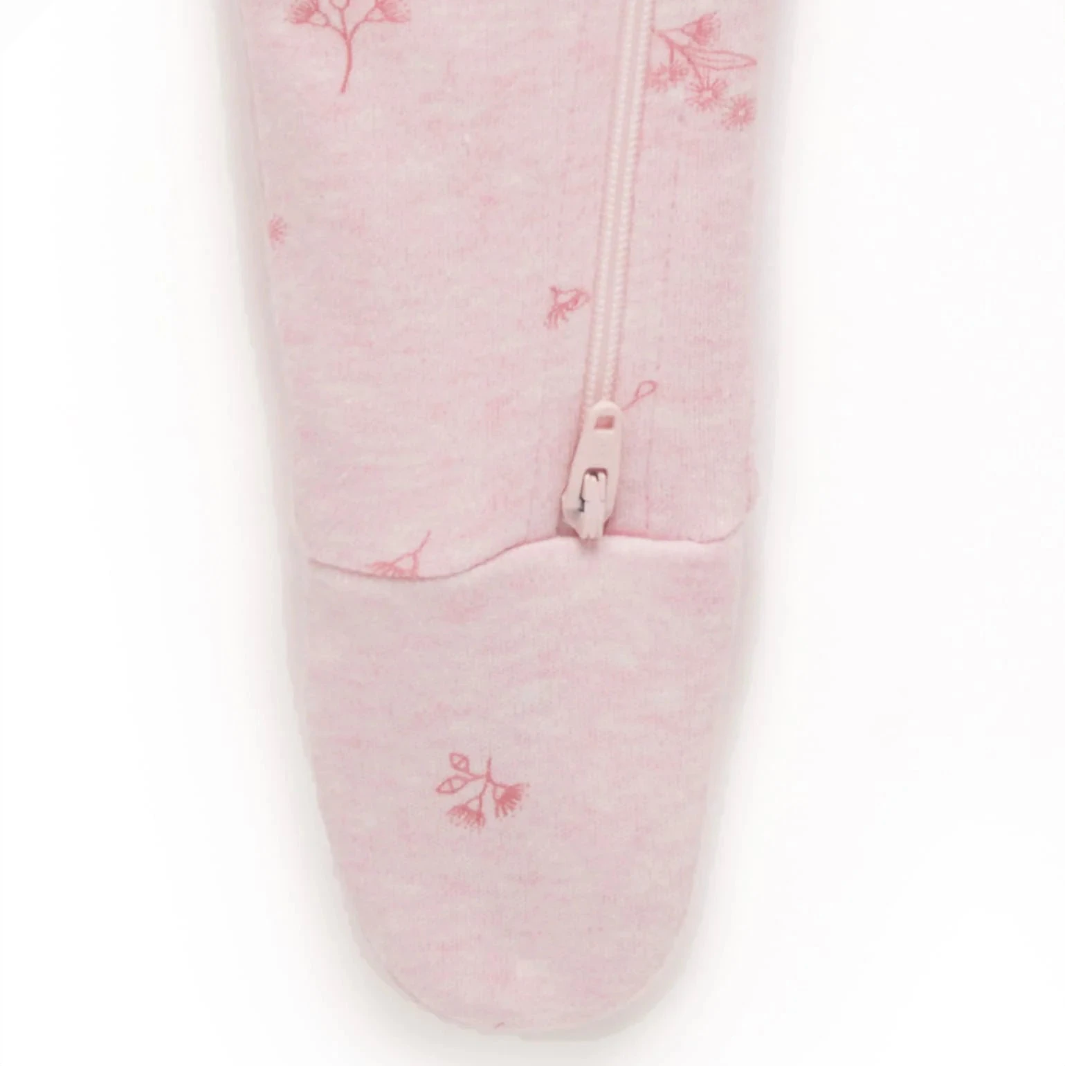 Close up of organic cotton pointelle fabric on pink blossom baby growsuit