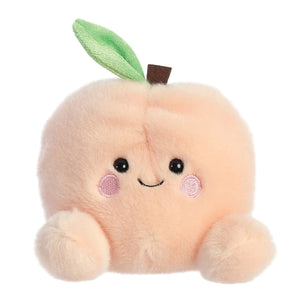Palm Pals Mellow Peach soft toy in peach plush with smiling face, 13cm baby toy with bean-filled body suitable from birth.