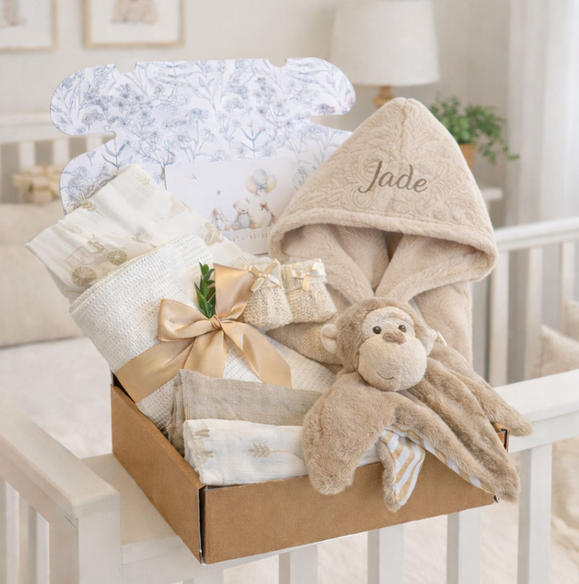 Personalised new baby box with beige baby bath robe and monkey dressing gown. The perfect present.