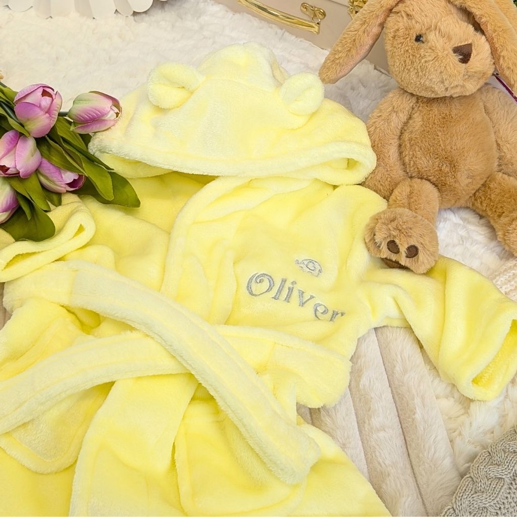 Personalised baby dressing gown in yellow with cute ears. With the name Oliver embroidered on the left