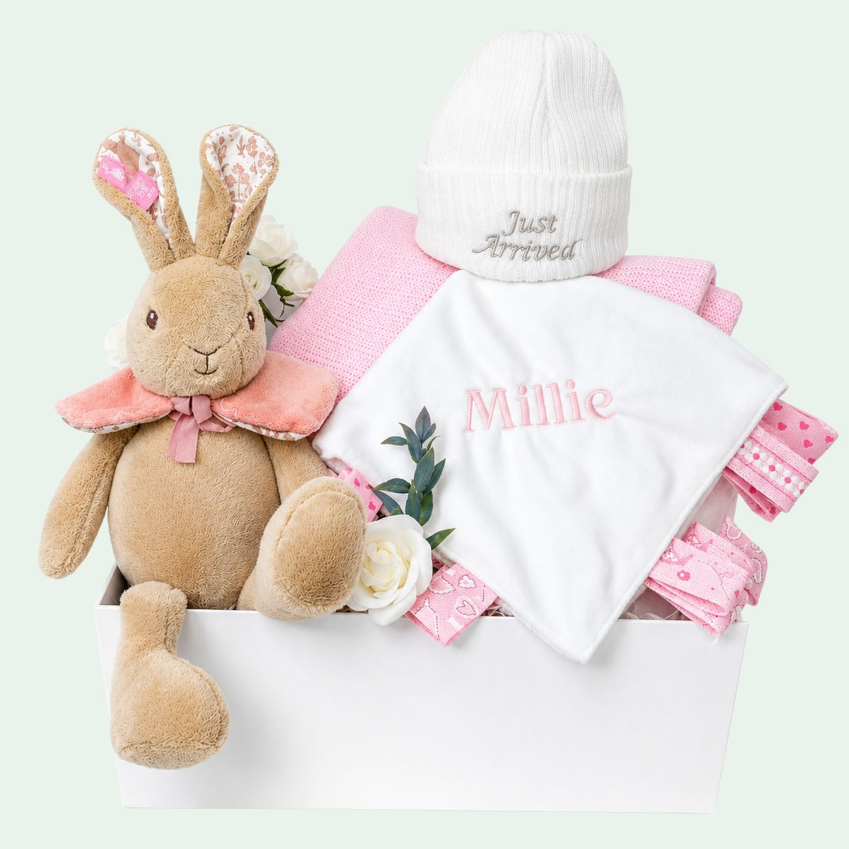 Personalised baby girl gift box by Bumbles and Boo. Presents in this hamper include Flopsy Bunny and pink personalised Millie comforter.