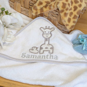 Baby towel with embroidered giraffe and duck design, can be personalised.