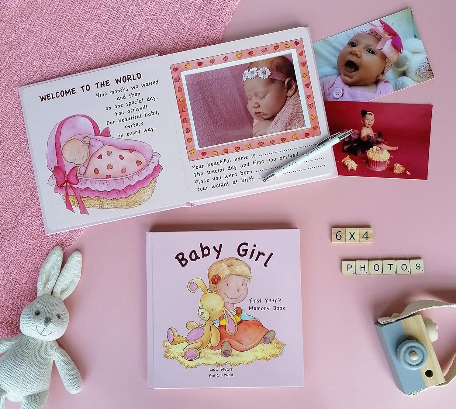 Keepsake photo album with space for 6x4 baby girl photos