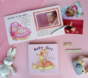 Keepsake photo album with space for 6x4 baby girl photos