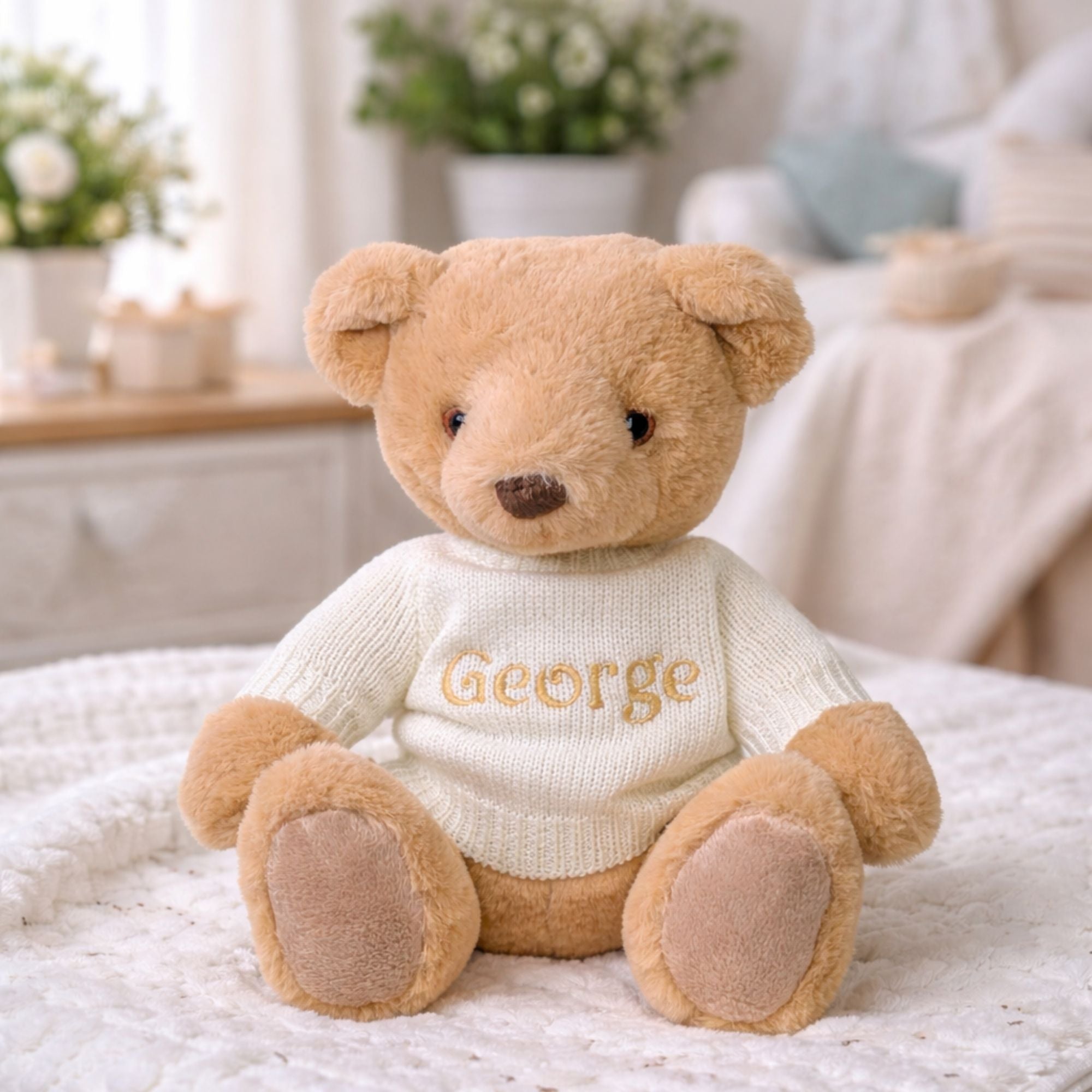 Personalised teddy bear with a jumper customised with an embroidered name ‘George’
