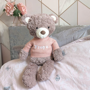 Personalised large putty teddy bear by Mary Meyer with pink jumper embroidered with the name 'Freya'