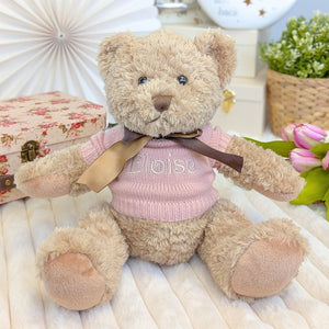 Teddy bear wearing a pink jumper personalised with the name Eloise