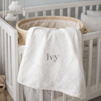 White personalised baby blanket with a personalised name