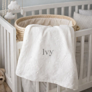 White personalised baby blanket with a personalised name