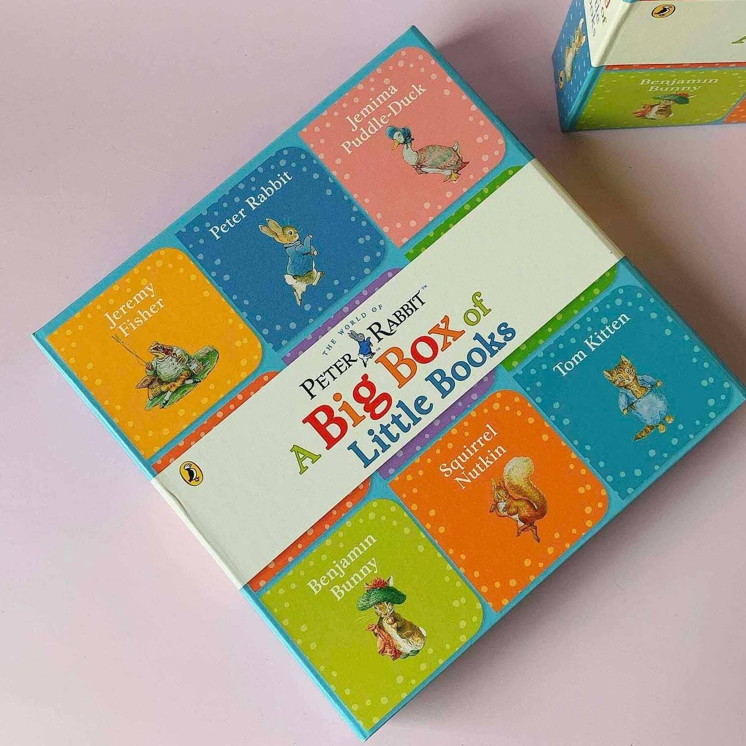 Peter Rabbit little books collection displayed on pink background