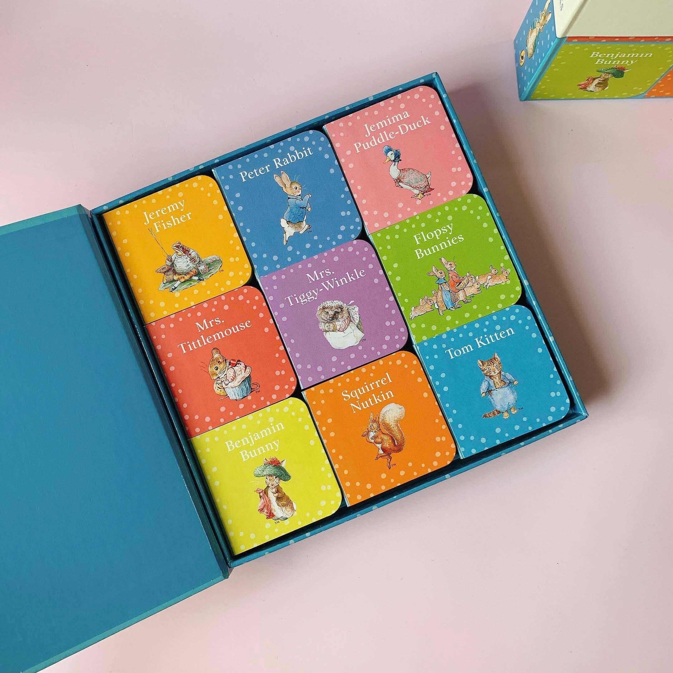 Peter Rabbit little books collection displayed on pink background