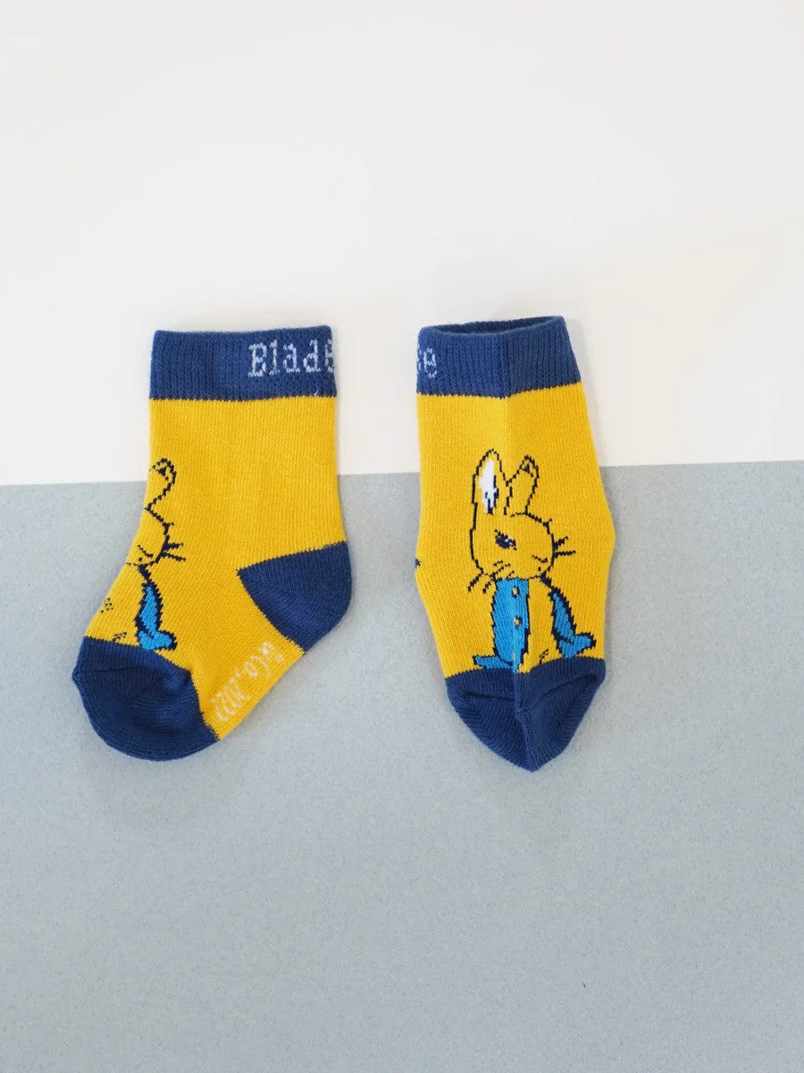 Yellow Peter Rabbit socks with navy accents